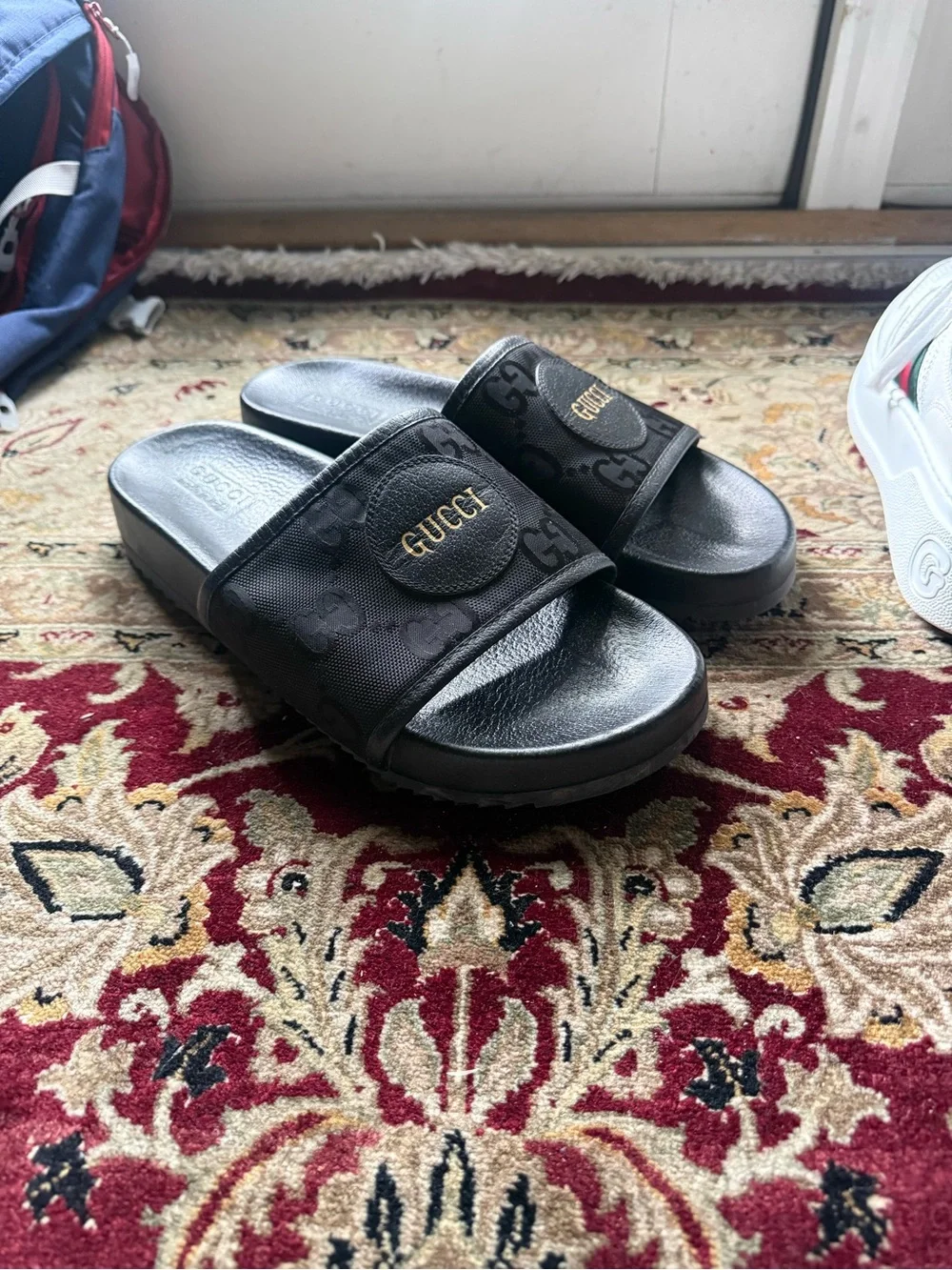 Gucci Black GG Monogram Slide Sandals with Gold Logo